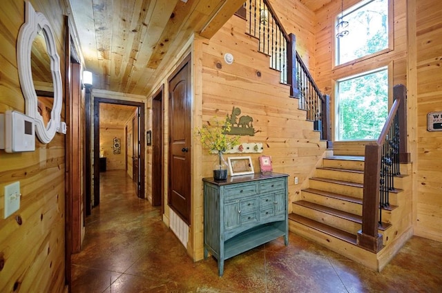 corridor with wood walls and wooden ceiling