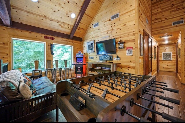 playroom featuring wood ceiling, wood walls, wood-type flooring, and vaulted ceiling with beams