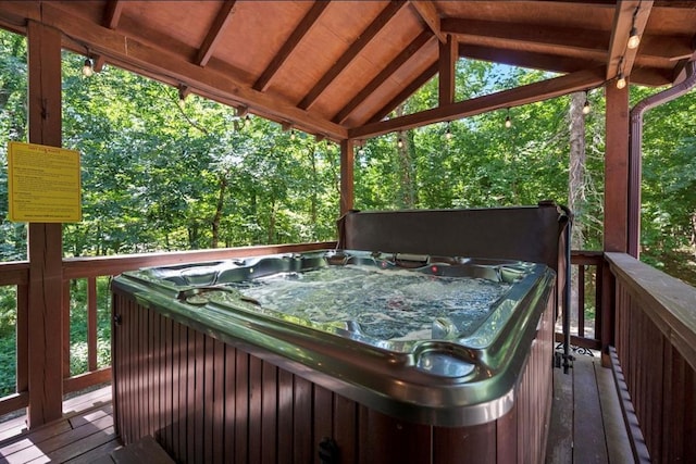 deck featuring a hot tub