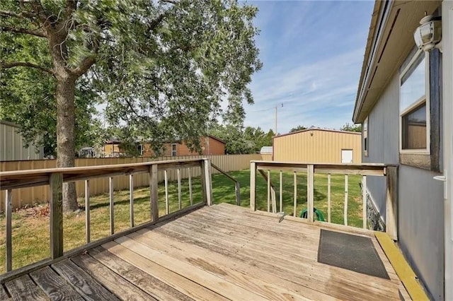 wooden deck featuring a yard