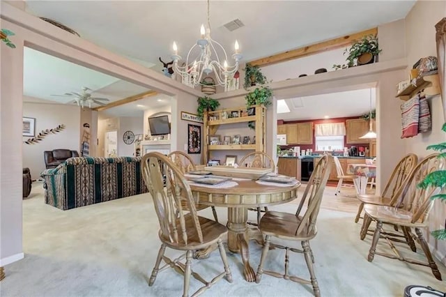 dining room featuring ceiling fan with notable chandelier and light carpet