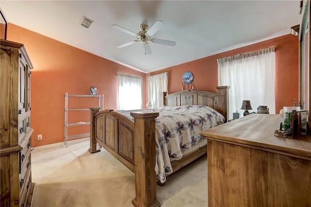 carpeted bedroom with lofted ceiling and ceiling fan