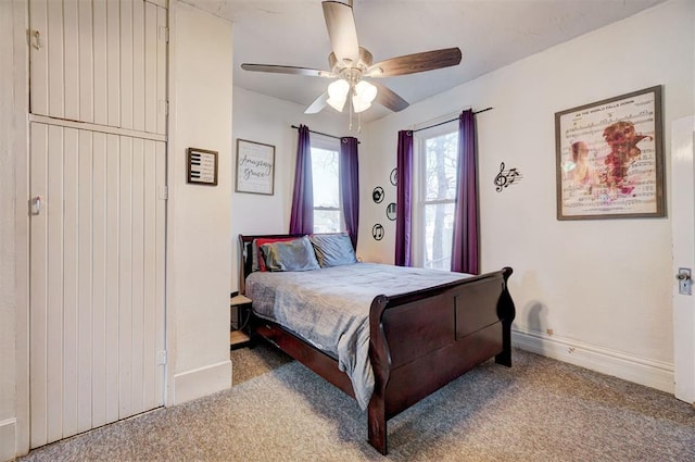 bedroom featuring ceiling fan and light colored carpet