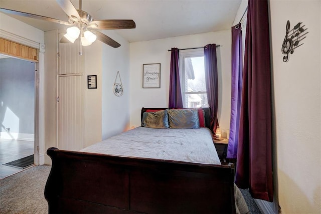 bedroom featuring ceiling fan and carpet