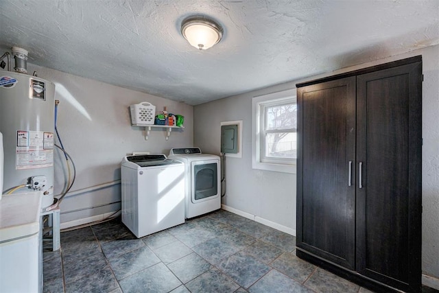 laundry room with independent washer and dryer, water heater, electric panel, and a textured ceiling