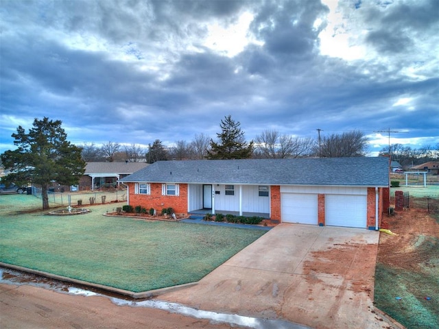 ranch-style house with a garage and a front yard