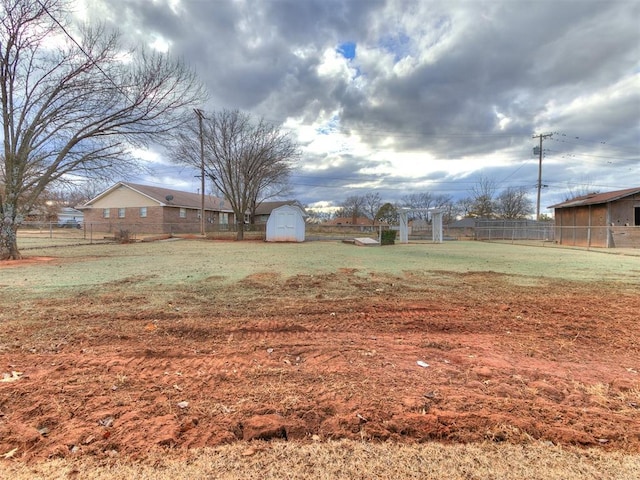 view of yard with a storage unit