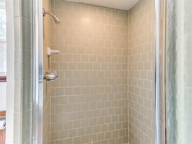 bathroom with a tile shower