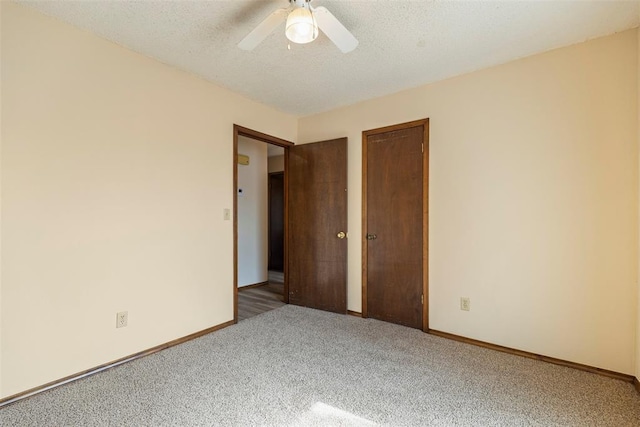 spare room with ceiling fan, carpet floors, and a textured ceiling