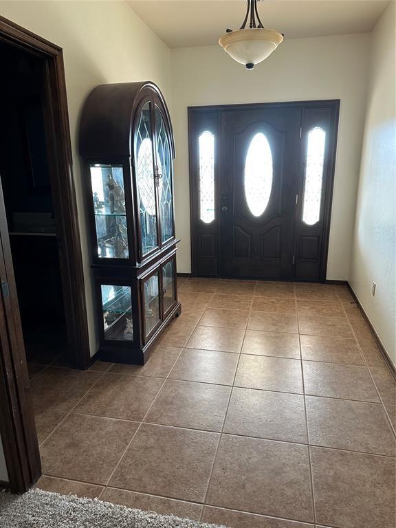 foyer entrance with tile patterned floors