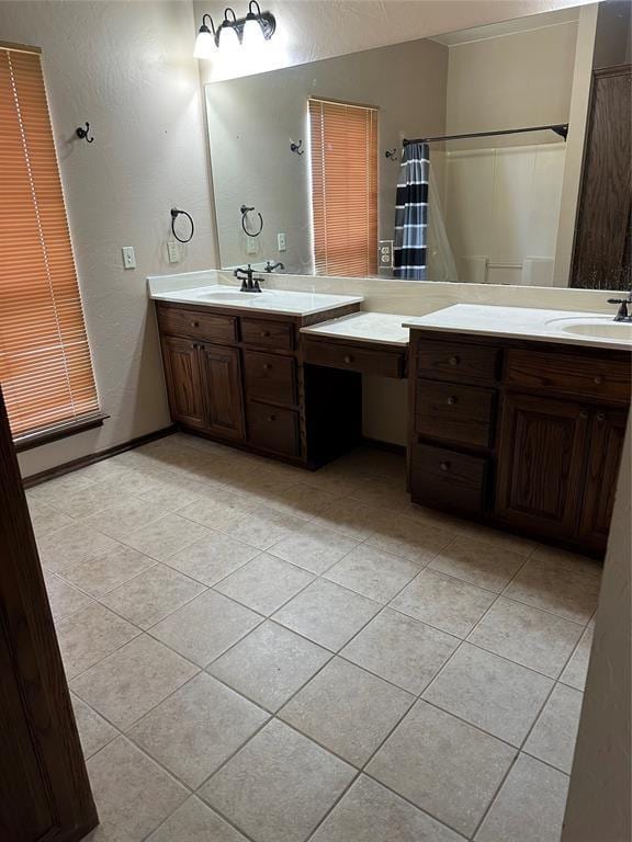 bathroom featuring tile patterned floors and vanity