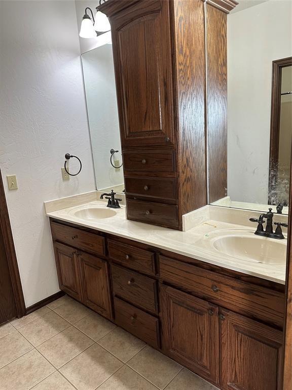 bathroom with tile patterned flooring and vanity