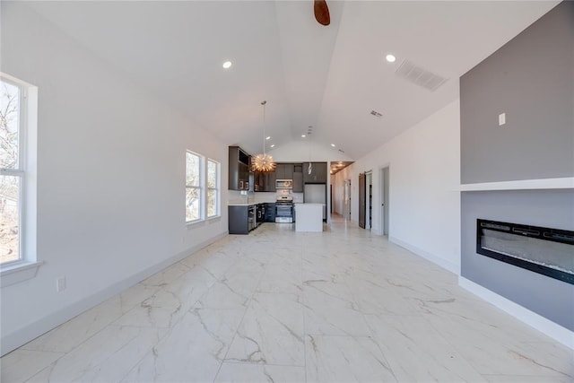 unfurnished living room featuring lofted ceiling