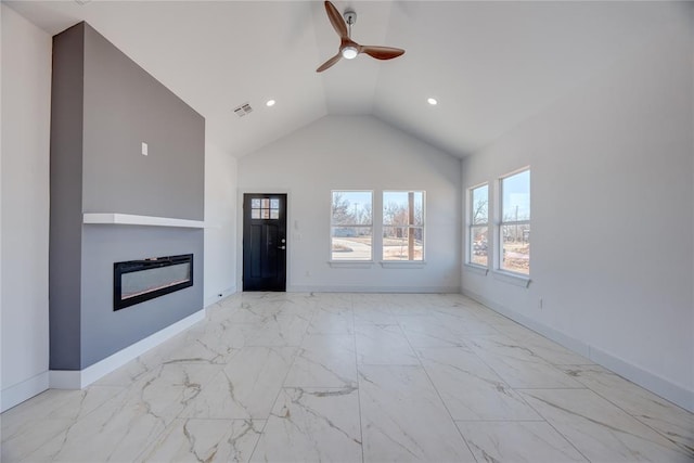 unfurnished living room with ceiling fan and high vaulted ceiling