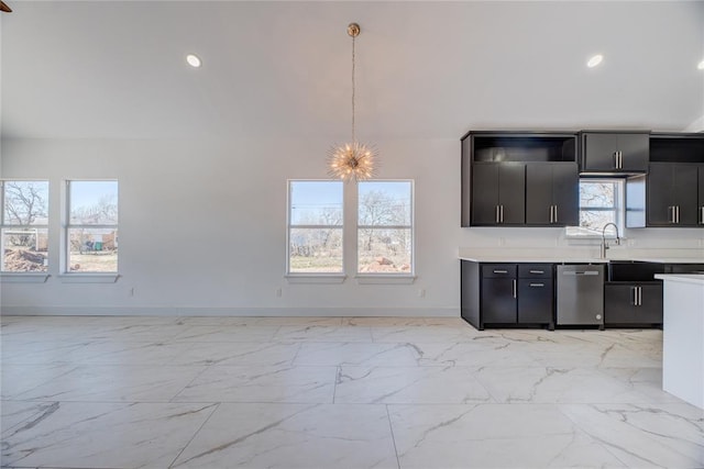 kitchen featuring pendant lighting, a notable chandelier, and stainless steel dishwasher