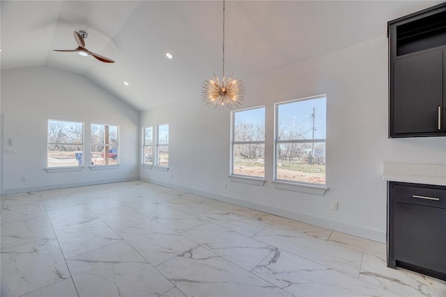 unfurnished living room featuring lofted ceiling and ceiling fan with notable chandelier