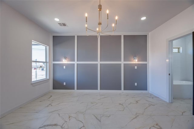 interior space featuring built in features and a notable chandelier