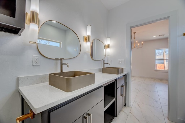 bathroom featuring vanity and a wealth of natural light