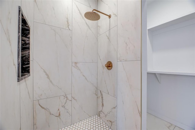 bathroom with tiled shower