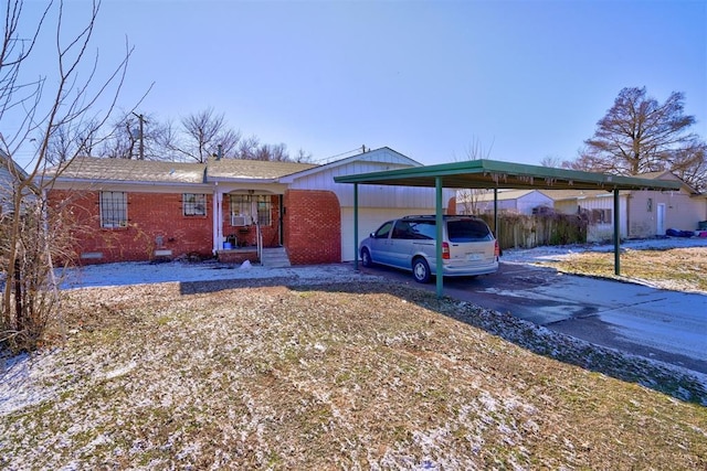 single story home featuring a carport