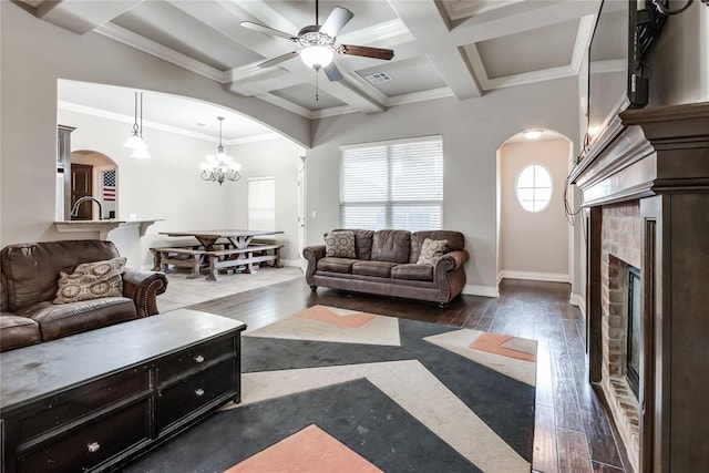 living room featuring beam ceiling, coffered ceiling, dark hardwood / wood-style floors, and a fireplace