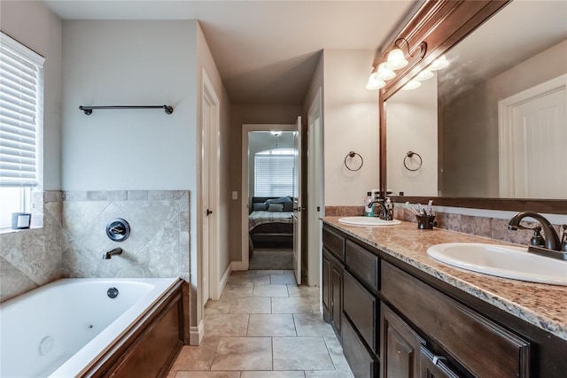 bathroom featuring vanity, a tub, and tile patterned floors