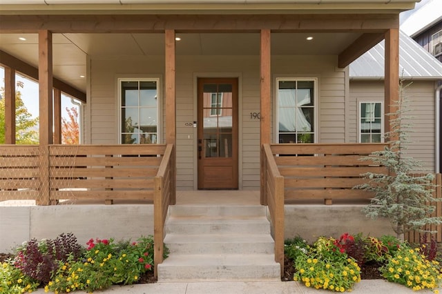 property entrance featuring a porch