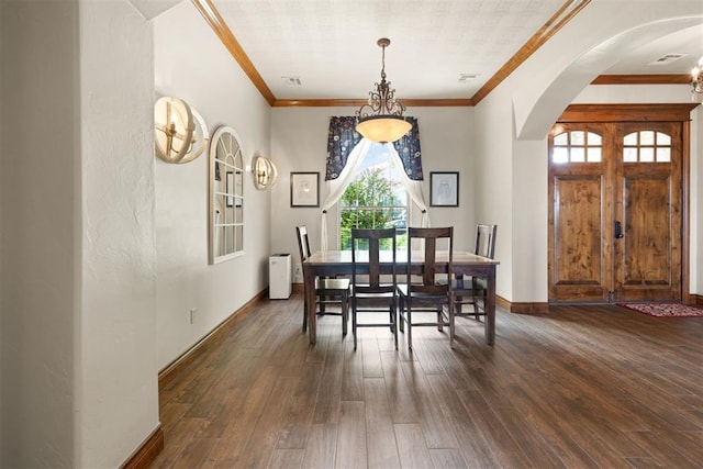 dining space with crown molding and dark hardwood / wood-style floors