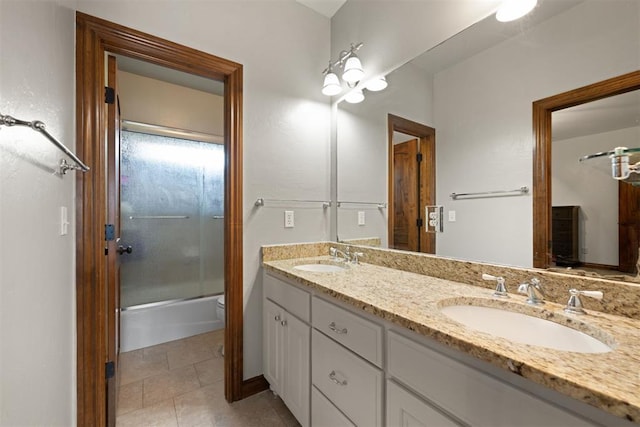 bathroom with vanity, tile patterned floors, and shower / bath combination with glass door