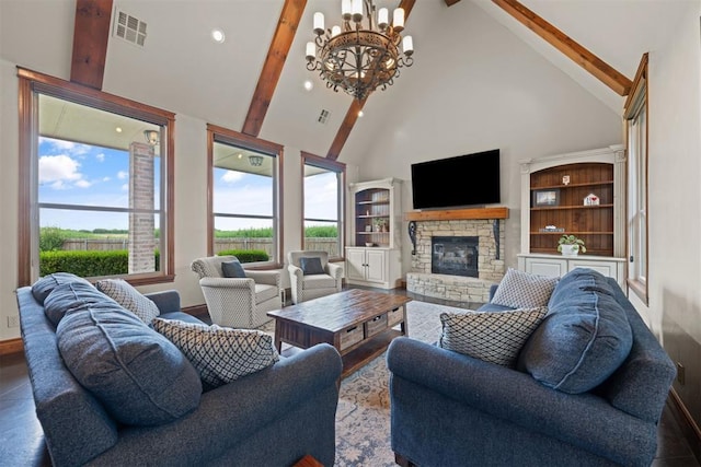 living room with beamed ceiling, a stone fireplace, a chandelier, and high vaulted ceiling