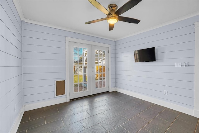 unfurnished room featuring crown molding, ceiling fan, and french doors