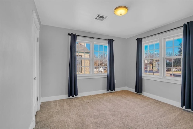 unfurnished room with light colored carpet