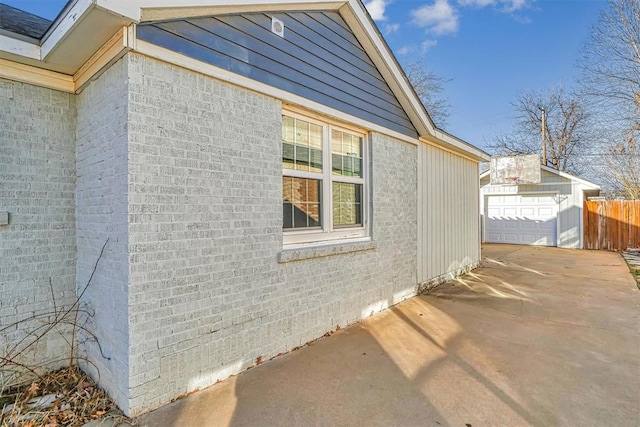 view of home's exterior featuring an outbuilding and a garage