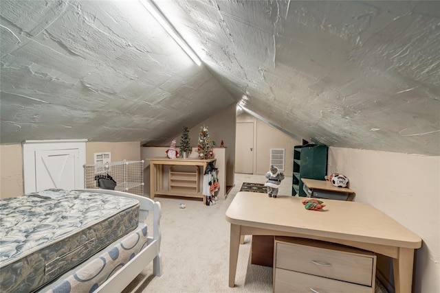 bedroom with vaulted ceiling and carpet flooring