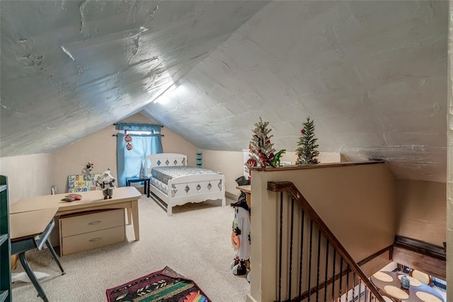 carpeted bedroom with lofted ceiling