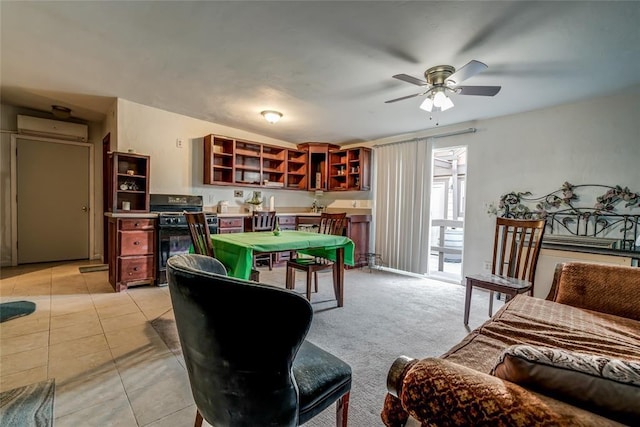 rec room featuring light carpet, a wall unit AC, and ceiling fan