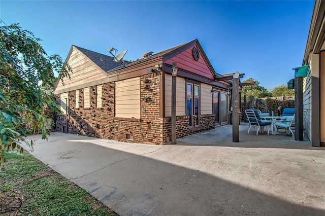 view of home's exterior featuring a patio area