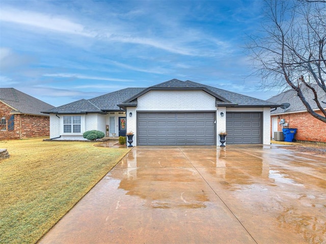 ranch-style house with a garage and a front yard