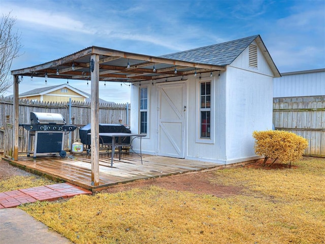 view of outdoor structure featuring a lawn