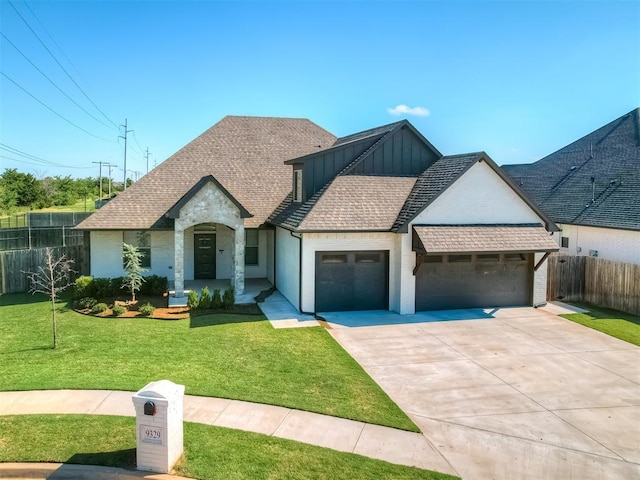 view of front of home featuring a garage and a front yard