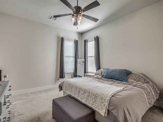 bedroom with ceiling fan and carpet