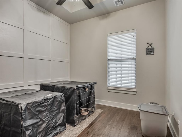 interior space with dark wood-type flooring and ceiling fan