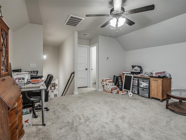 carpeted office with ceiling fan and vaulted ceiling