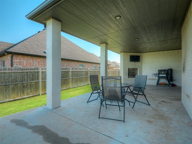 view of patio / terrace with a large fireplace