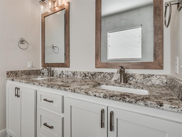 bathroom with double vanity and a sink