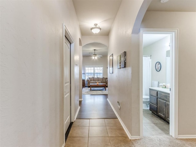 corridor with light tile patterned floors