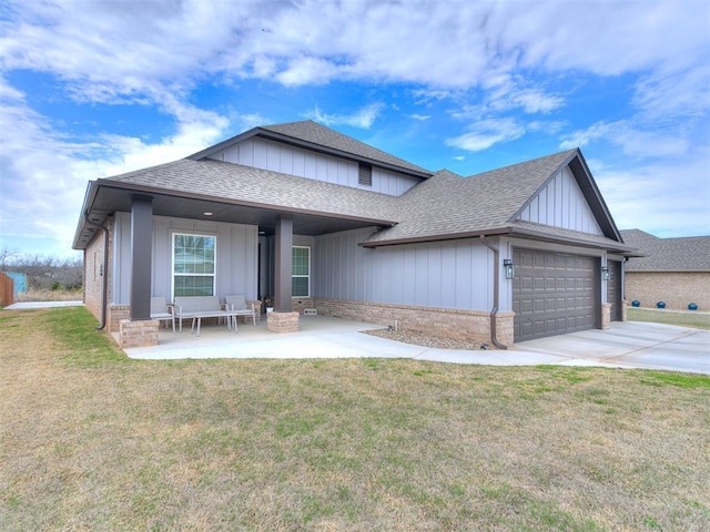 view of front of property with a garage and a front lawn