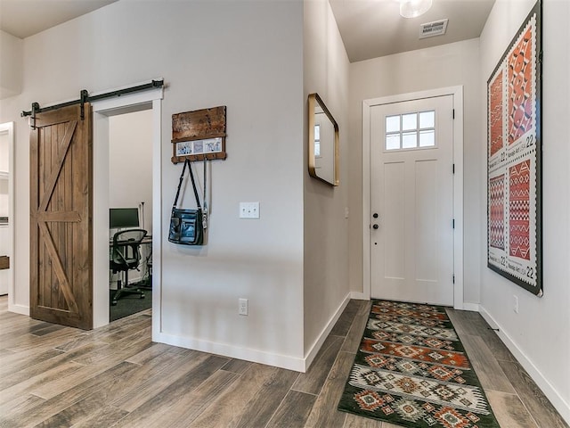 entrance foyer featuring a barn door