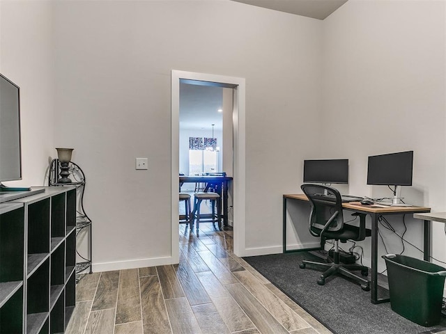 office area featuring a chandelier