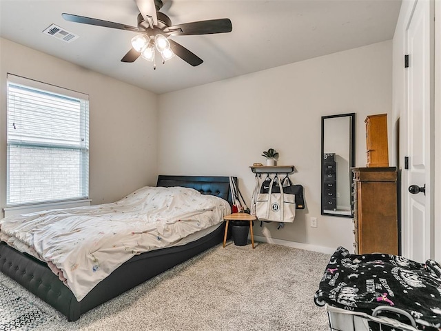 bedroom with ceiling fan and carpet floors